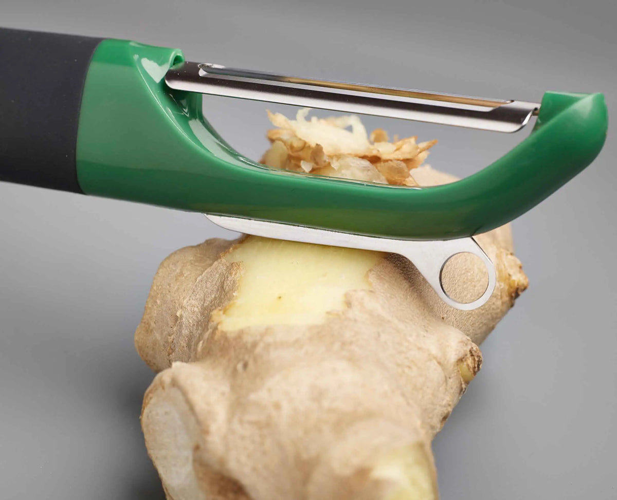 Detail of the potato eye remover at the tip of the straight peeler