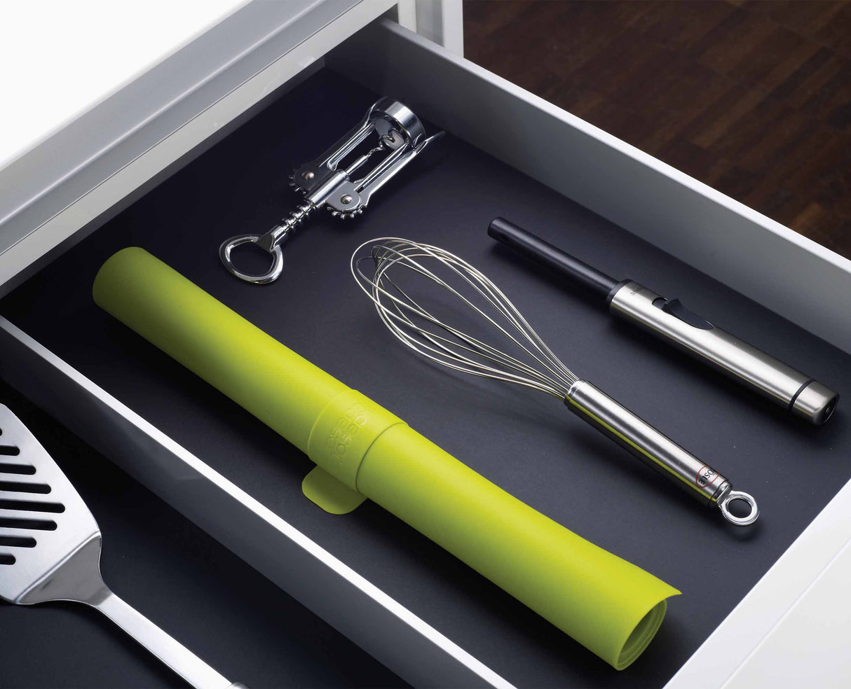Rolled baking mat shown compact at 38 cm for drawer or hook storage.