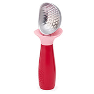 Joseph Joseph Dimple non-drip ice-cream scoop in pink with a weighted handle.