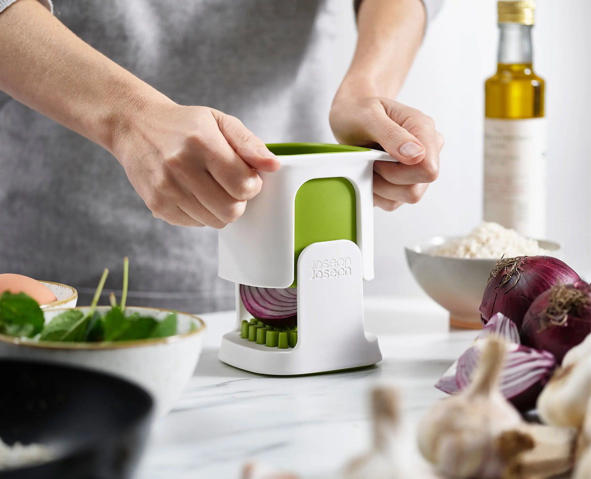 An onion being chopped with the ChopCup.