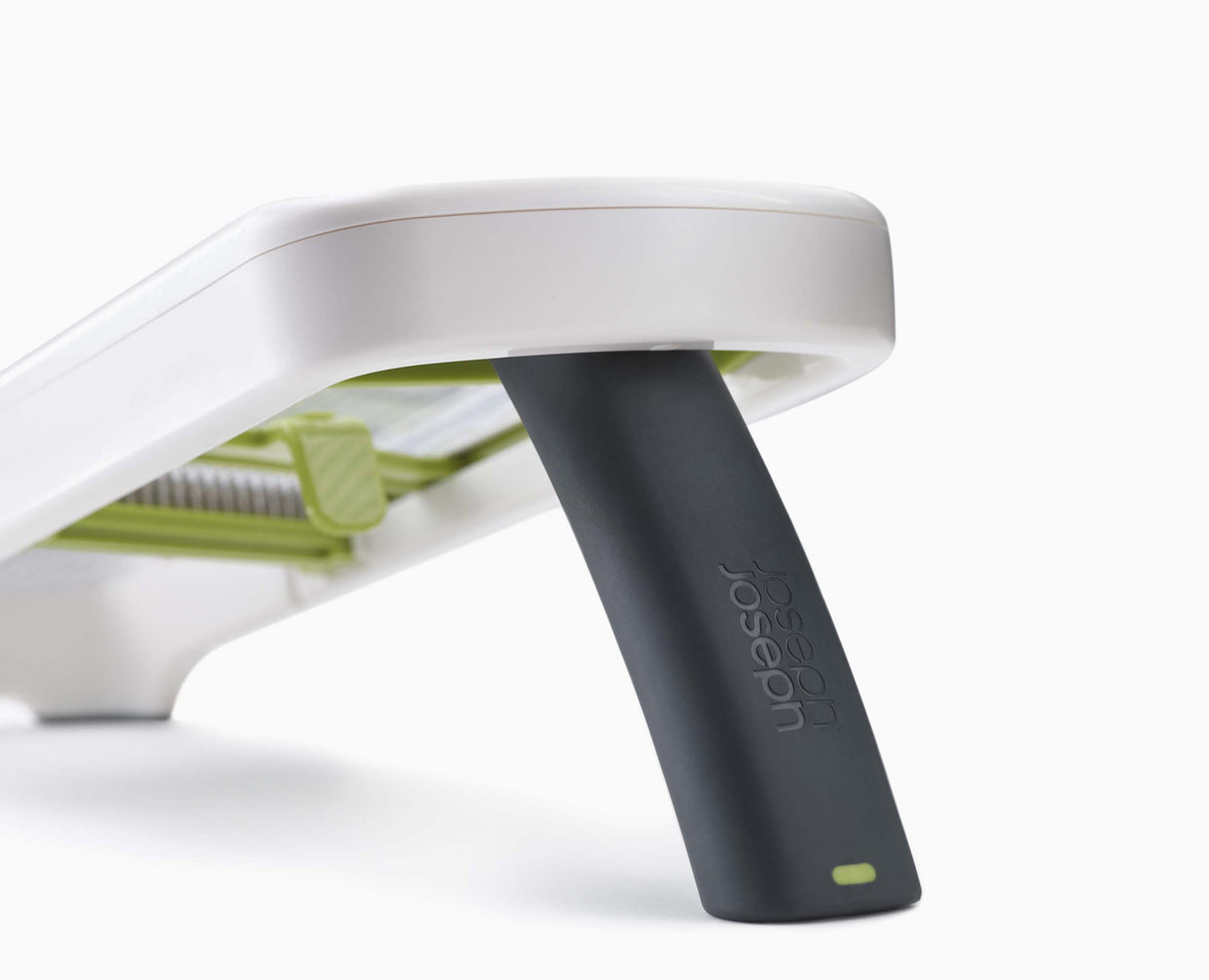 The mandoline's folding easy-grip handle and non-slip feet.