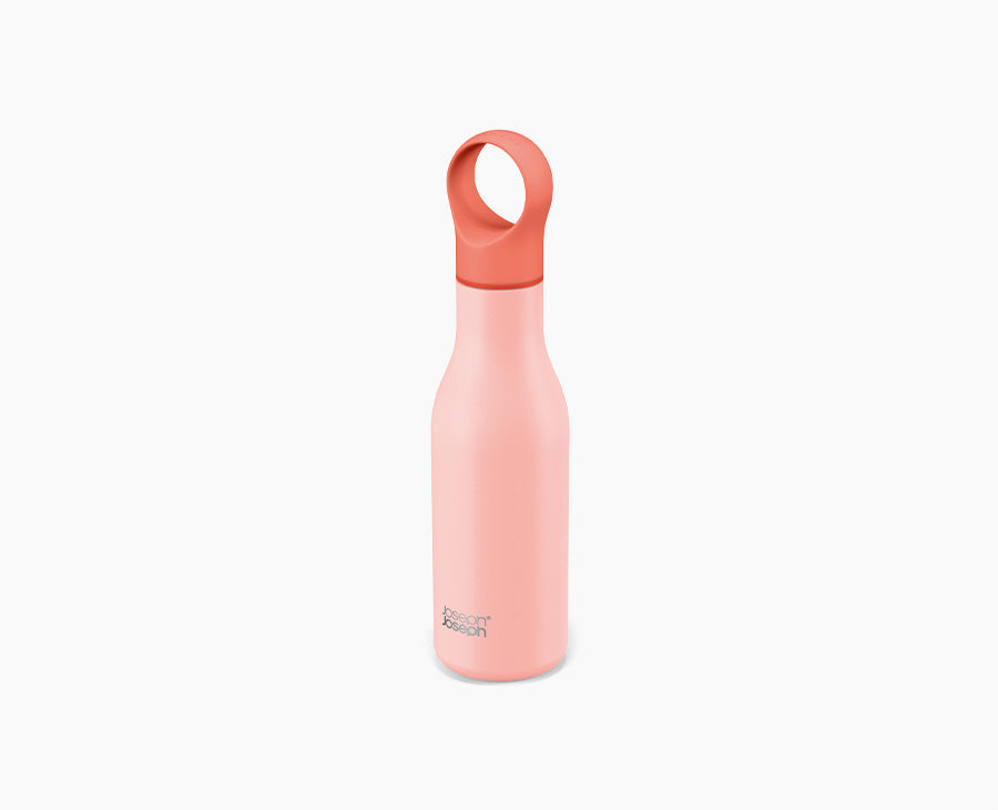 Joseph Joseph Loop vacuum-insulated water bottle in coral, standing upright with the cap on.