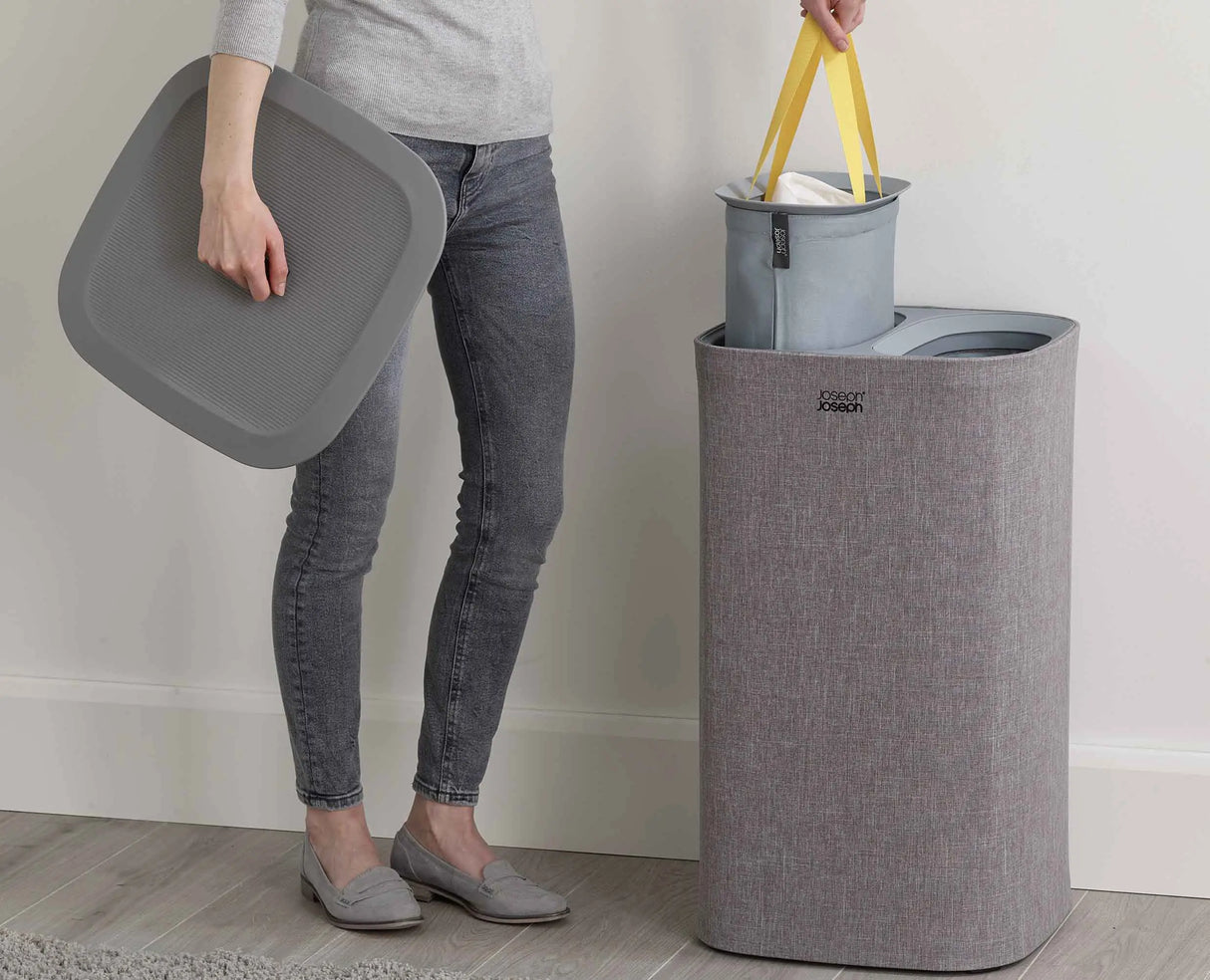Handle on the base of the bag used to tip laundry into a washing machine.