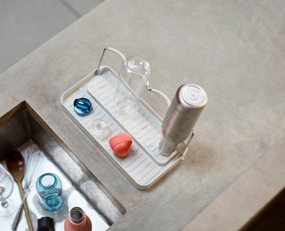 Joseph Joseph DrySmart folding bottle drying rack in stone folded flat for storage, Homelux Kenya