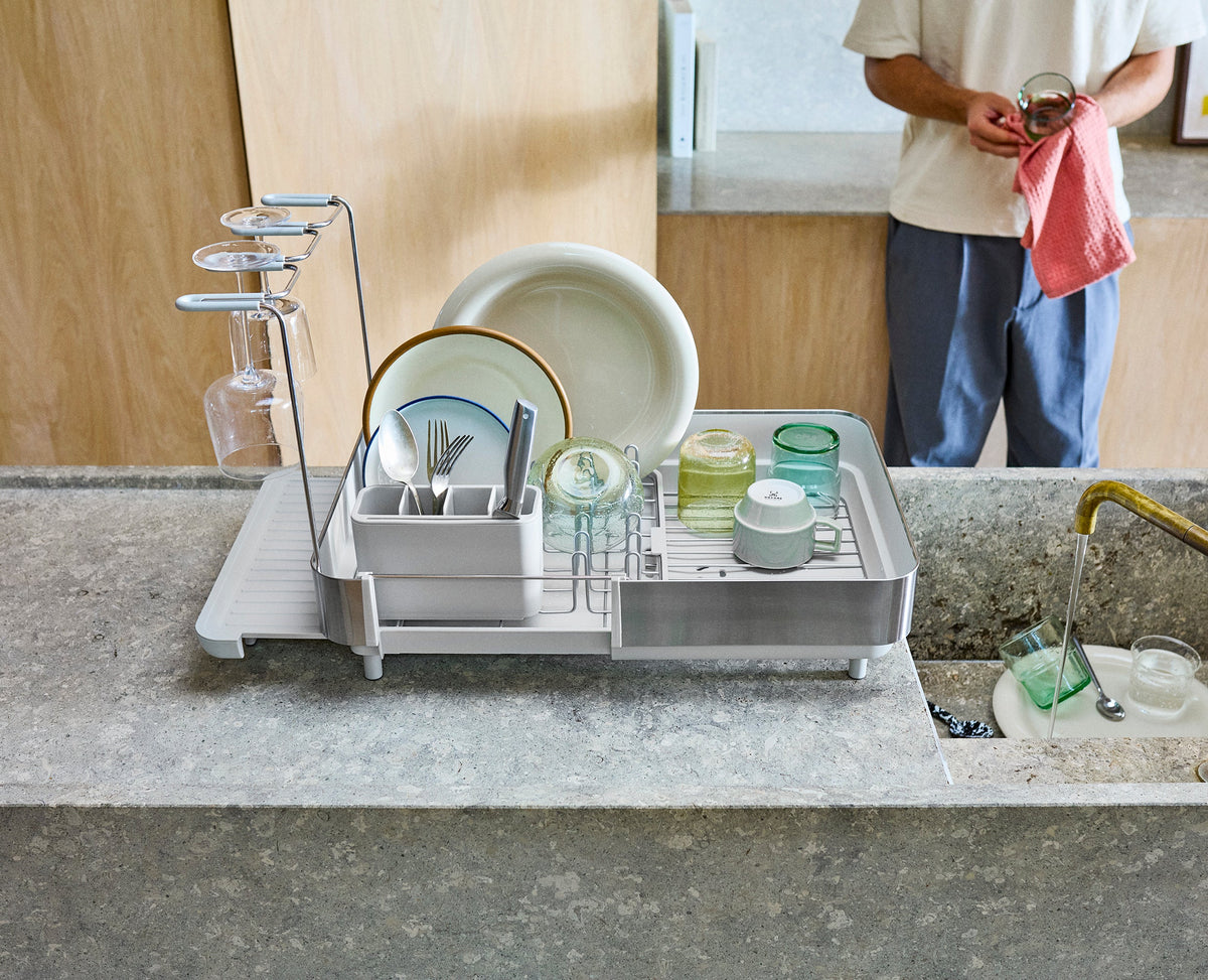 Joseph Joseph Extend Steel Plus expandable dish rack in stone wine glass rail in use, Homelux Kenya