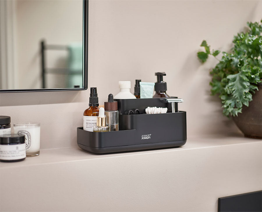 Joseph Joseph EasyStore bathroom caddy compartments filled with toothbrushes and razors