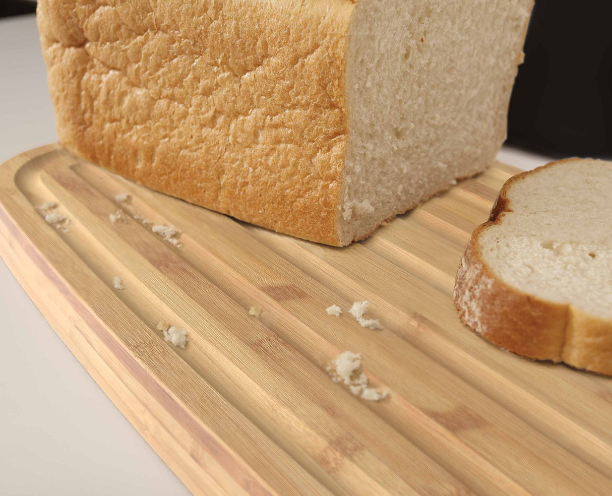 Overall view of the bread bin's black body paired with its bamboo cutting board lid.