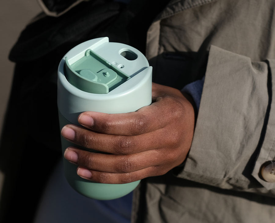 The flip-top cap opened to reveal the covered drinking mouthpiece.