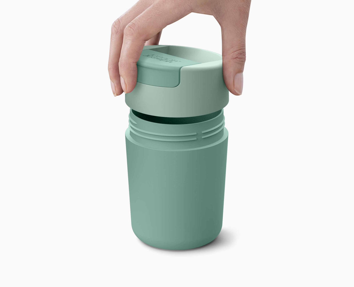 Side view of the green Sipp travel mug showing its 14 cm height.