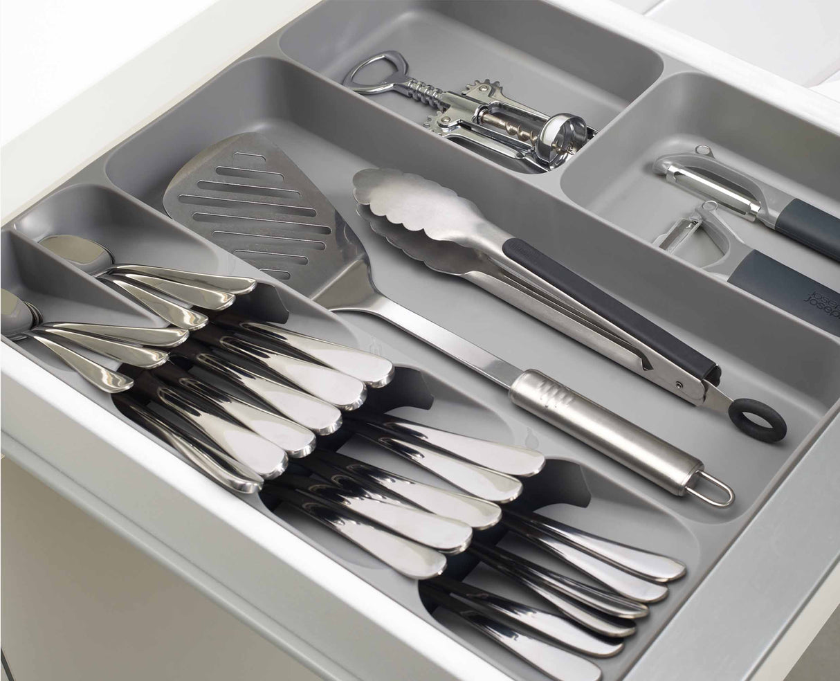 The twin gadget compartments holding bulkier kitchen tools such as a tin opener.