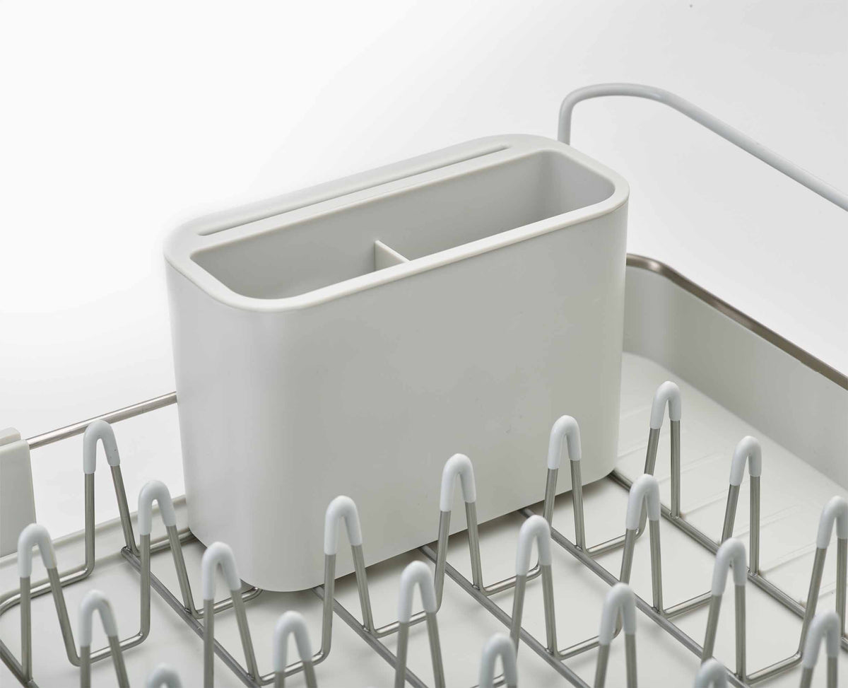 Joseph Joseph Extend Steel dish rack in stone in a kitchen setting