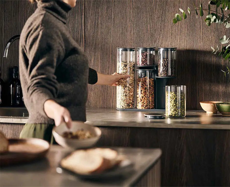 The stepped stand shown from the side, with each container at a different level.