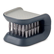 Joseph Joseph BladeBrush knife and cutlery cleaner in grey with a non-slip finish.
