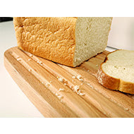 Angled view of the aubergine Joseph Joseph melamine bread bin and its beech wood lid.