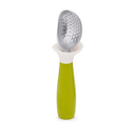 Joseph Joseph Dimple non-drip ice-cream scoop in green with a weighted handle.