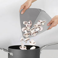 Folding action of the grey Joseph Joseph Duo chopping board, third product image