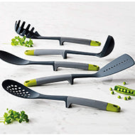 Joseph Joseph Elevate slotted turner with weighted silicone handle in grey and green, third product view.