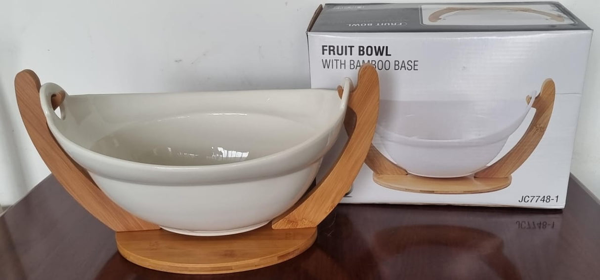 Ceramic fruit bowl on bamboo base