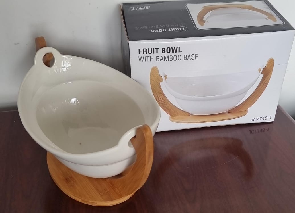 Ceramic fruit bowl on bamboo base