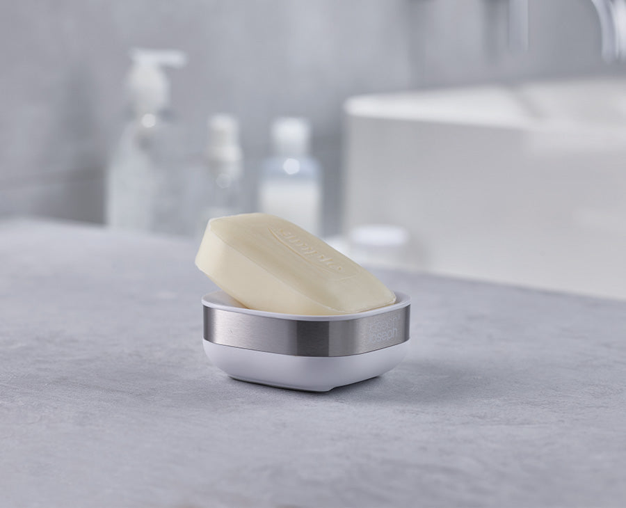 Side view of the soap dish showing the sloped, angled base that drains water away.