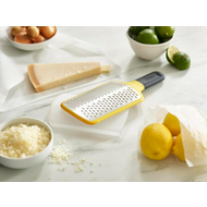 Joseph Joseph Multi-Grate paddle grater in yellow with coarse and fine blades, fifth product view.