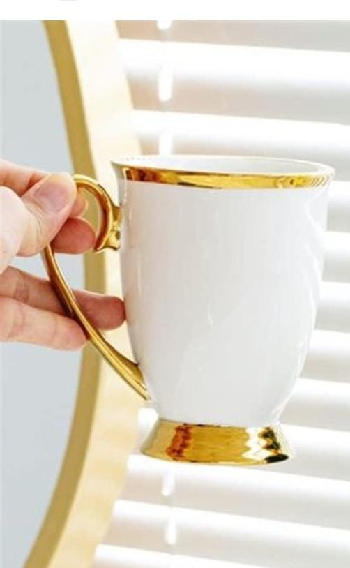 SHAPELY COLOURED CUP WITH GOLD RING