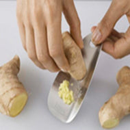 Stainless steel Joseph Joseph Shred-Line garlic and ginger grater, second product view.