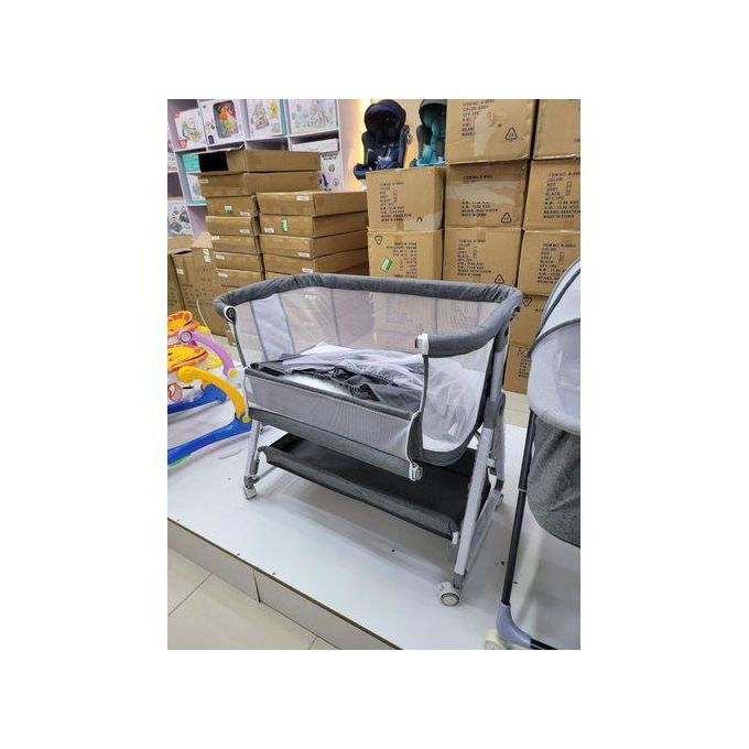 Baby co-sleeper with adjustable height.