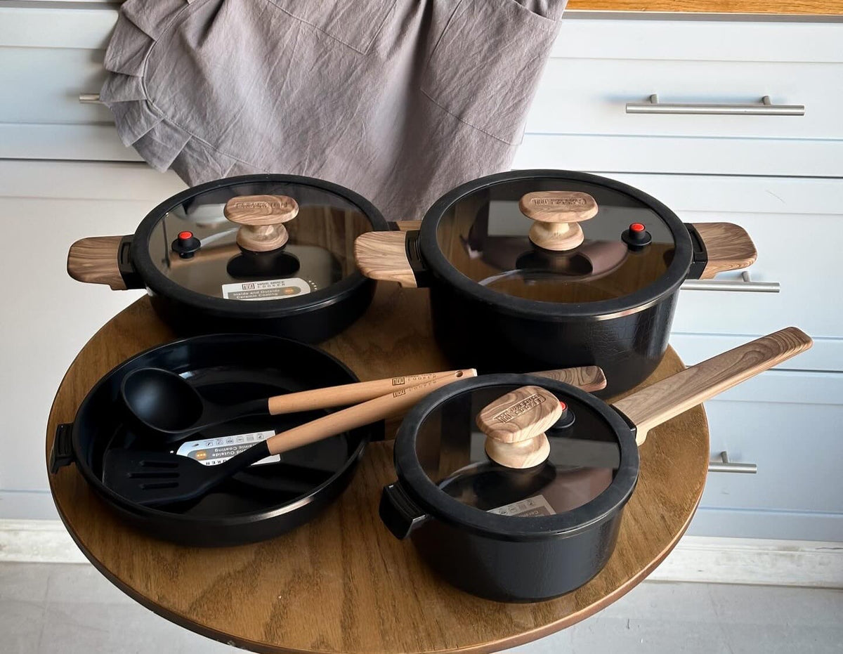 MGC Crocodile black cookware set on a kitchen table