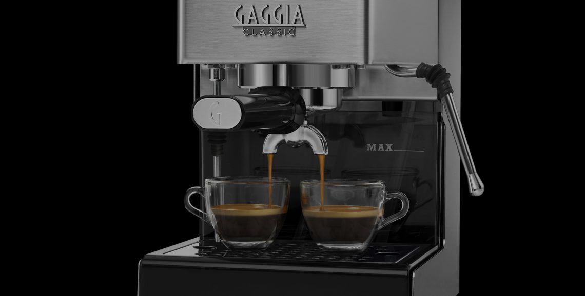 Close-up of the Gaggia Classic E24 58mm stainless steel portafilter and brass brew group
