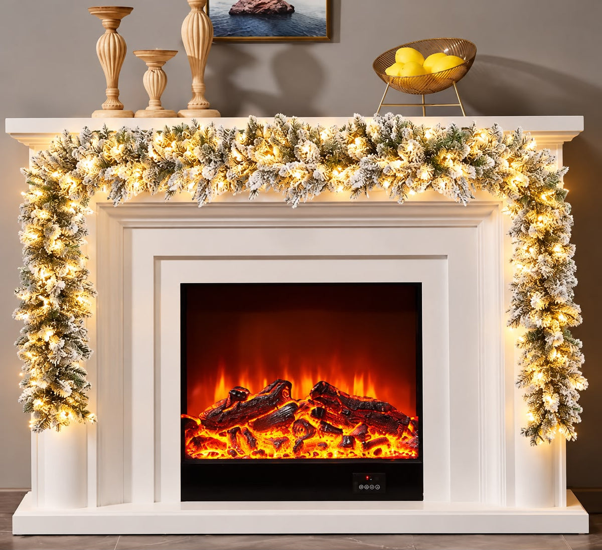 Snow flocked Christmas garland with built in warm white lights, 2.7m, on a fireplace mantel