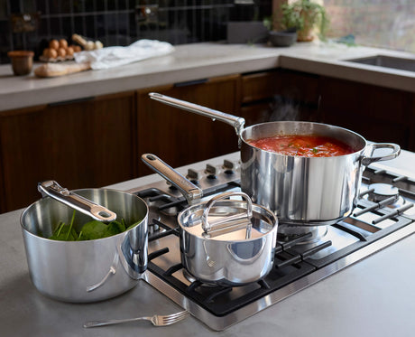 Joseph Joseph Space Steel saucepans stacked with handles folded for compact storage