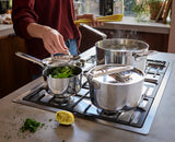 Joseph Joseph Space Steel saucepan handle folding flat against the pan