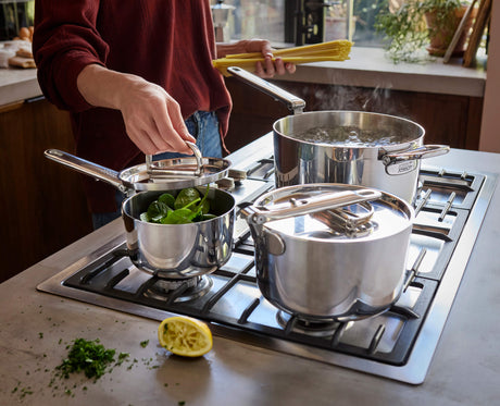 Joseph Joseph Space Steel saucepan handle folding flat against the pan