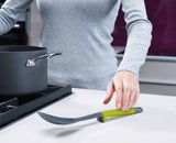 Close-up of an Elevate handle resting on its integrated tool rest with the nylon head lifted clear of the surface