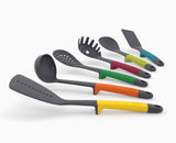 The multicolour Elevate utensil set standing together in a kitchen