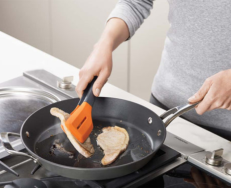 The Turner Tongs locked closed for compact storage in a drawer