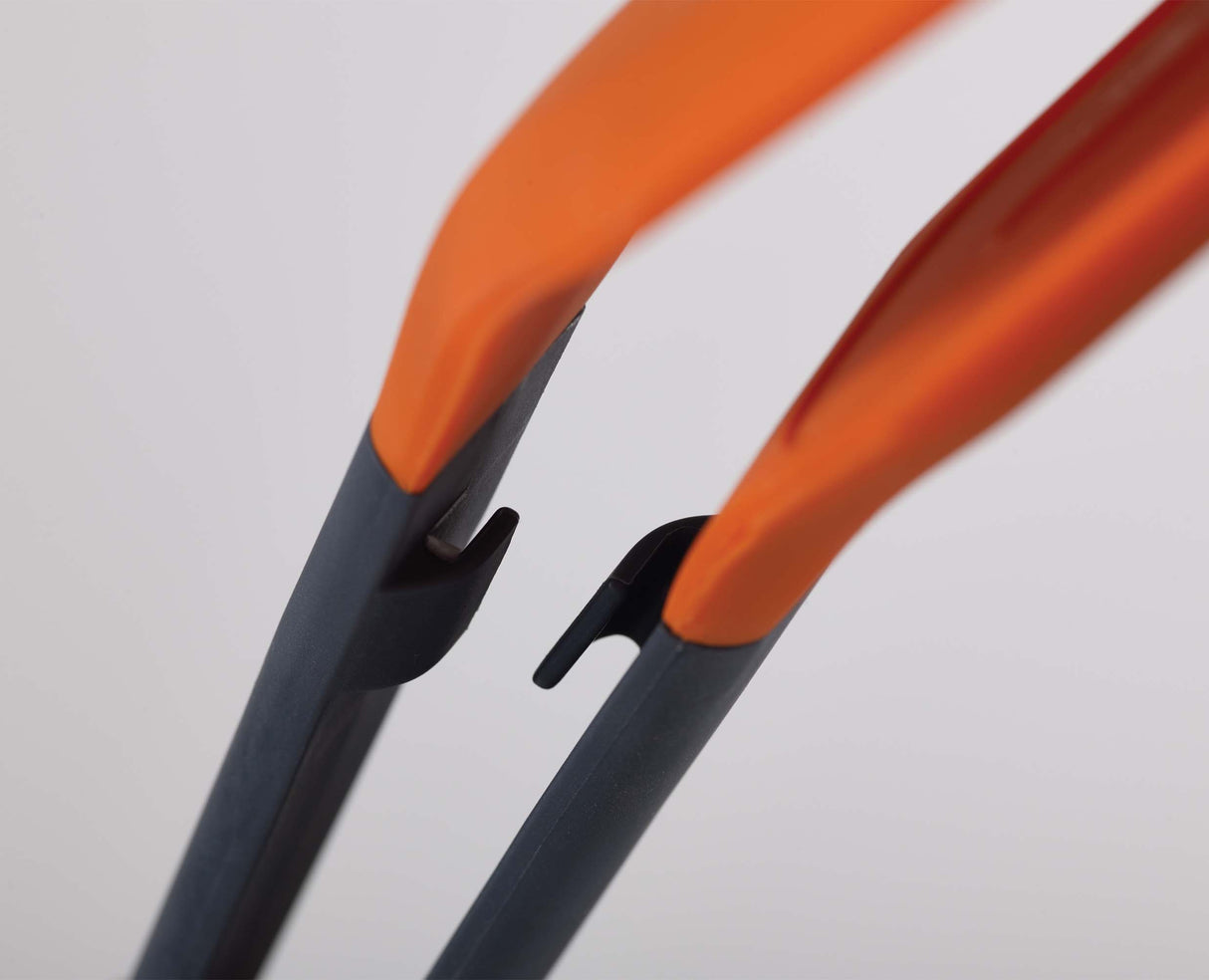 Turner Tongs being used to turn food in a frying pan