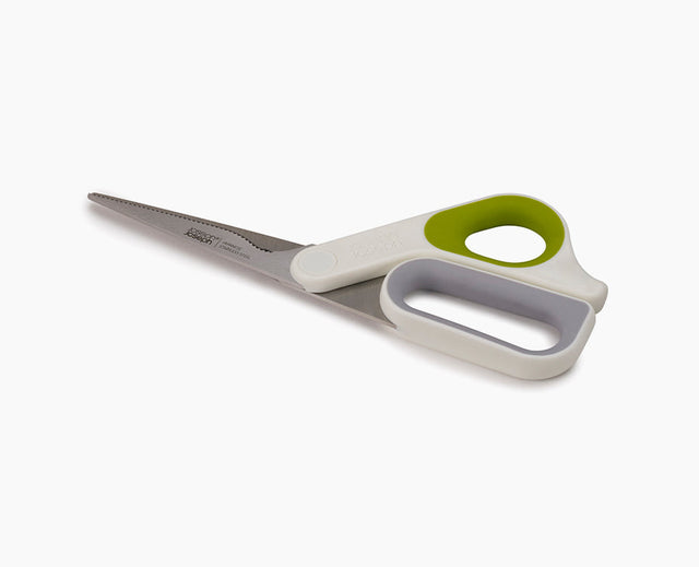 Joseph Joseph PowerGrip all-purpose kitchen scissors in green, shown closed
