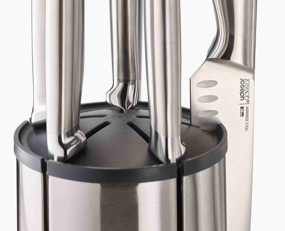 Close-up of a knife held magnetically against the rotating steel block