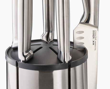 Close-up of a knife held magnetically against the rotating steel block