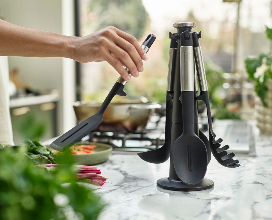 The rotating stand viewed from the side with all five utensils in place
