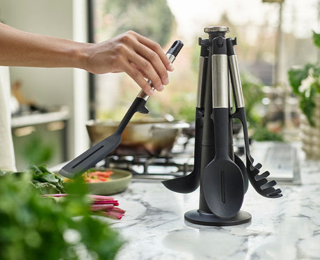 The rotating stand viewed from the side with all five utensils in place