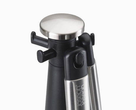 Close-up of a silicone utensil head and its weighted stainless-steel handle