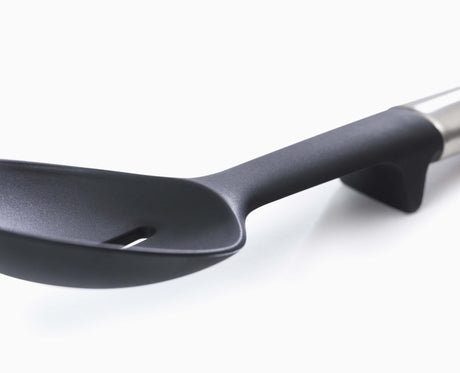 An Elevate utensil resting on its integrated tool rest with the head lifted off the counter