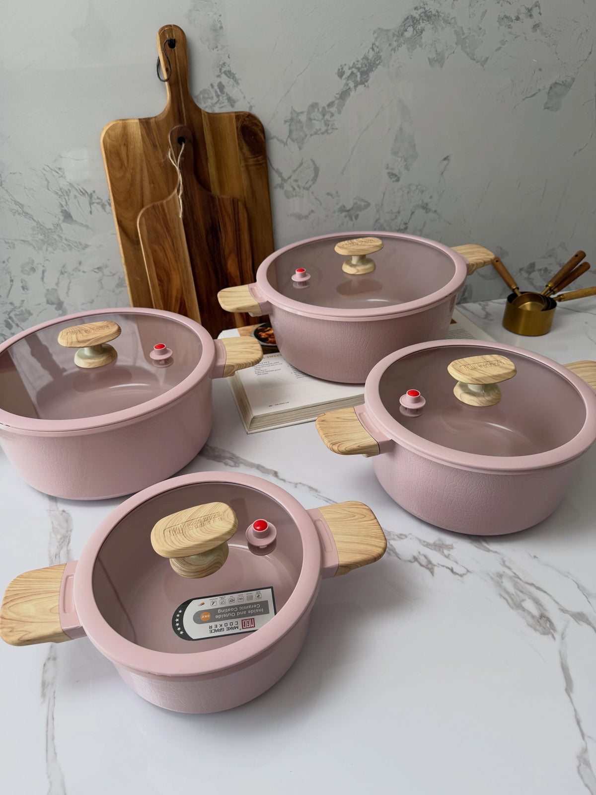 MGC Crocodile pink casseroles on a marble worktop