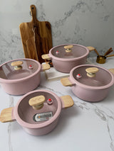 MGC Crocodile pink casseroles on a marble worktop