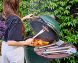 The four GrillOut BBQ tools packed flat inside the open protective case.