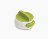 Joseph Joseph Can-Do compact can opener in white with a green twist top.