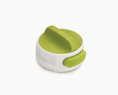 Joseph Joseph Can-Do compact can opener in white with a green twist top.